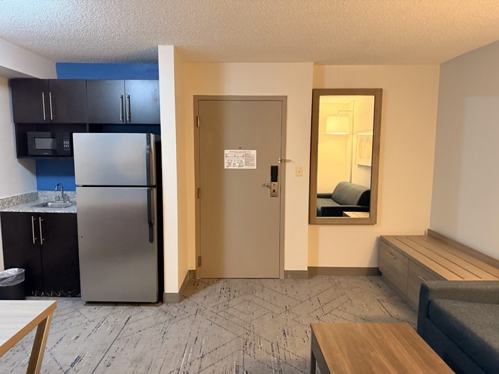 Suite entrance with kitchenette and seating area