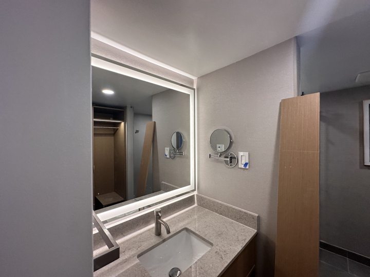 Bathroom vanity with an illuminated mirror